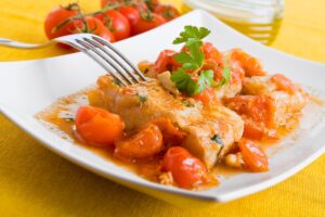 Merluza con tomate