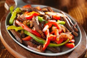 Bistec de ternera con pimientos rojos